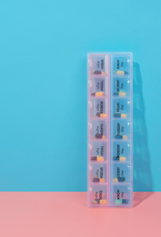 Pills box with pink and blue background